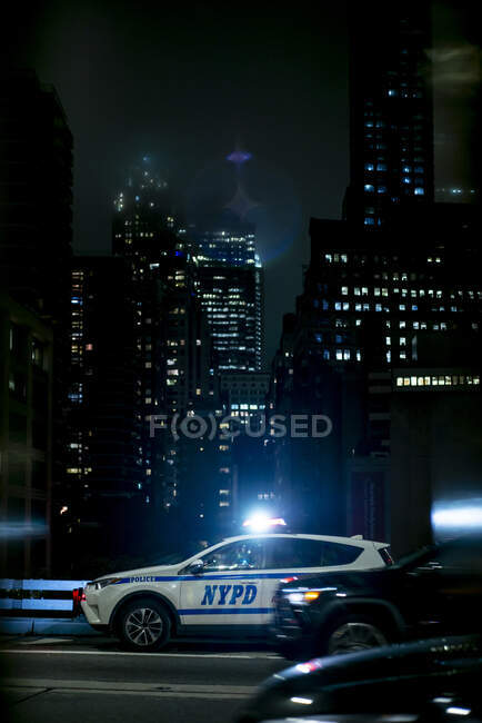 NewYork USA  NOV 20 Wide angle view of an NYPD police car parked by the  pavement of a busy midtown Manhattan street on the Stock Photo  Alamy