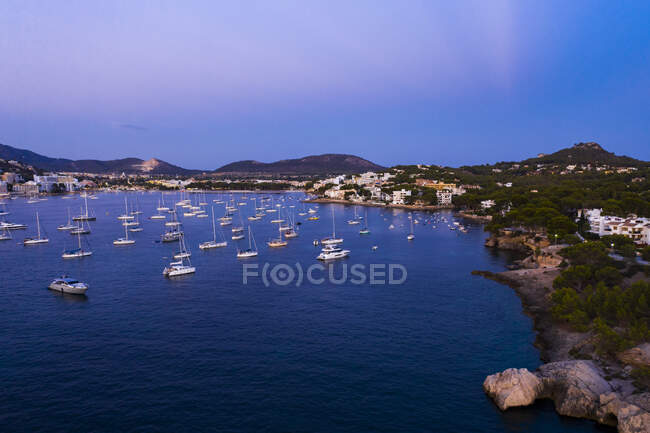 Spain, Balearic Islands, Mallorca, Calvia region, Aerial view over Costa de la Calma and Santa Ponca with sailboats in bay — Stock Photo