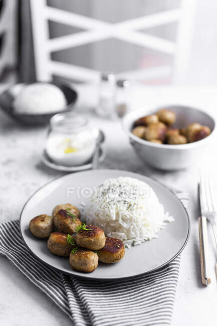 Plate of chicken meatballs with rice — Stock Photo
