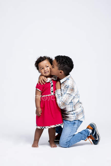 Boy kissing his little sister — Stock Photo
