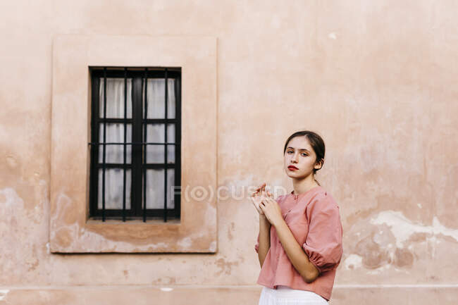 Portrait of teenage girl wearing pink blouse — Stock Photo