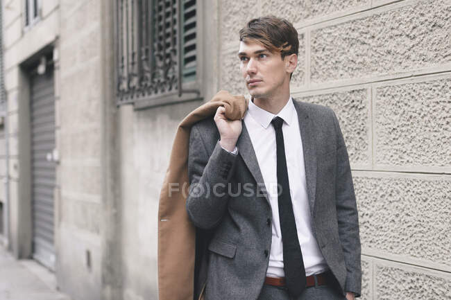 Portrait of young businessman in the city — Stock Photo