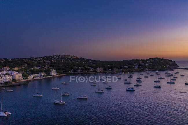 Spain, Mallorca, Santa Ponsa, Aerial view of boats floating in coastal water at dusk — Stock Photo