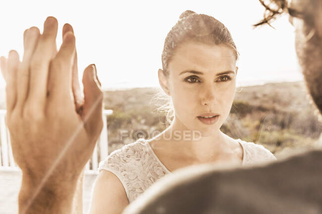 Portrait of affectionate woman looking at man at sunset — Stock Photo
