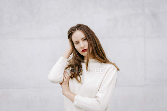 Portrait of young woman with red lips — Stock Photo
