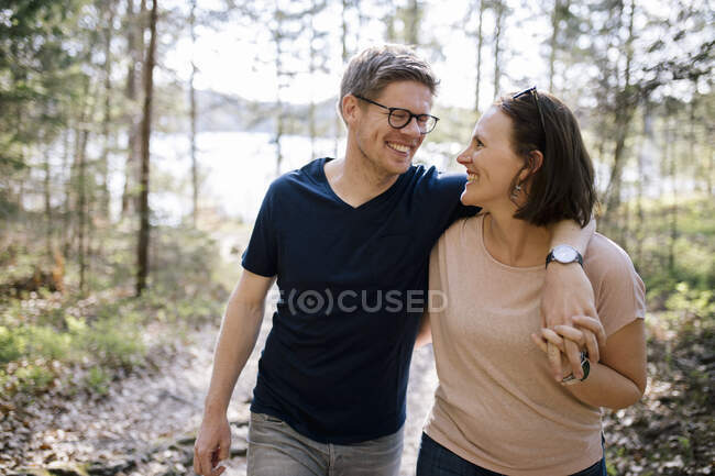 Happy couple in a forest — Stock Photo