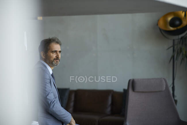 Portrait of a mature businessman in a lounge — Stock Photo