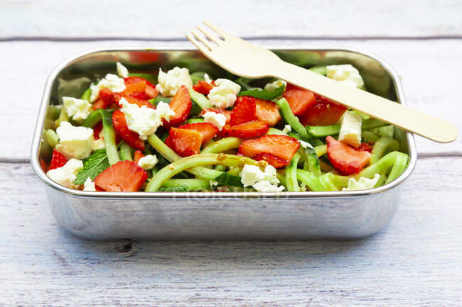 Metal lunch box with fresh mixed vegetarian salad — Stock Photo