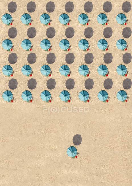 Aerial view of rows of turquoise colored beach umbrellas — Stock Photo