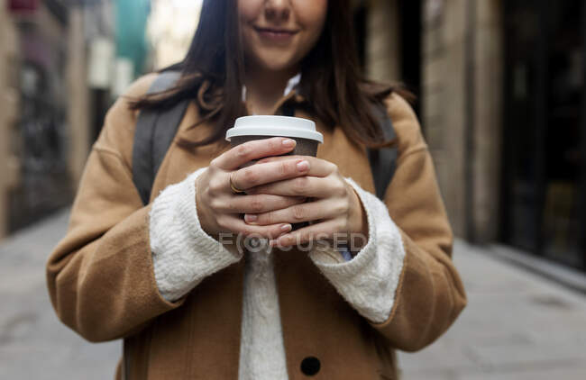 Close-up of young woman with takeaway coffee in the city, Barcelona, Spain — Stock Photo