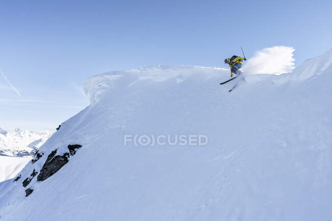 Skier, downhill skiing, Grisons, Switzerland — стокове фото
