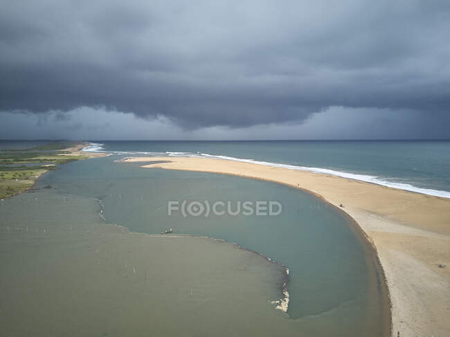 Benin, Grand Popo, Aerial view of storm clouds over sandy beach of Mono River — Stock Photo