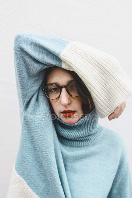 Portrait of young woman wearing turtleneck pullover — Stock Photo