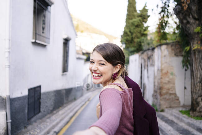Portrait of happy woman in the city — Stock Photo