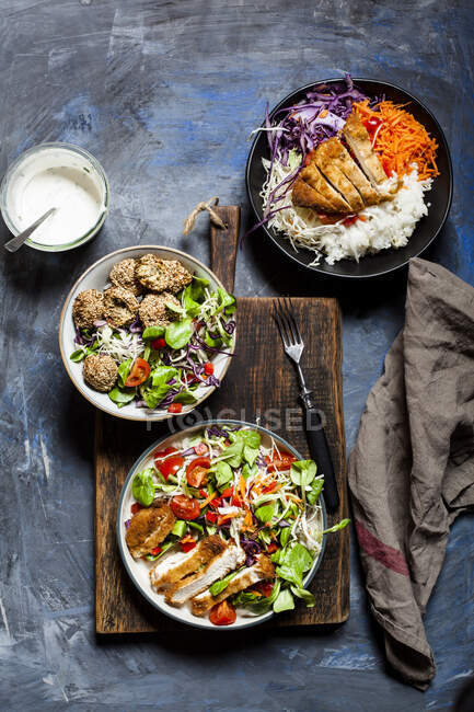 Bowls with three different ready-to-eat salads — Stock Photo