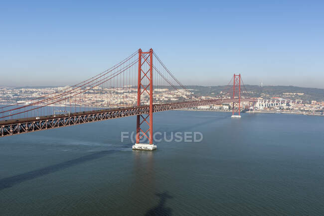 Portugal, Lisbon, Clear sky over 25 de Abril Bridge — Stock Photo