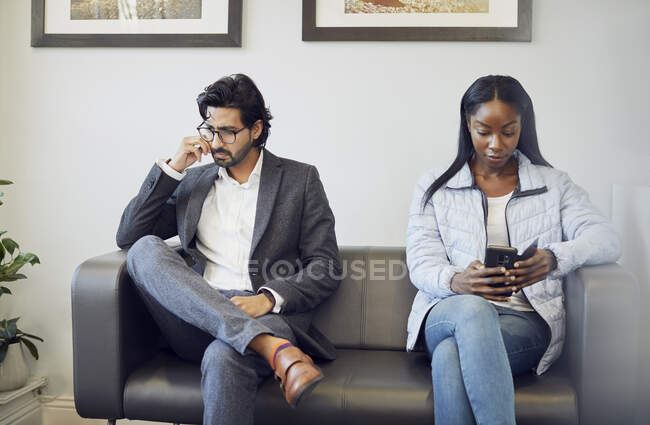 Two patients in waiting room of a medical practice — Stock Photo