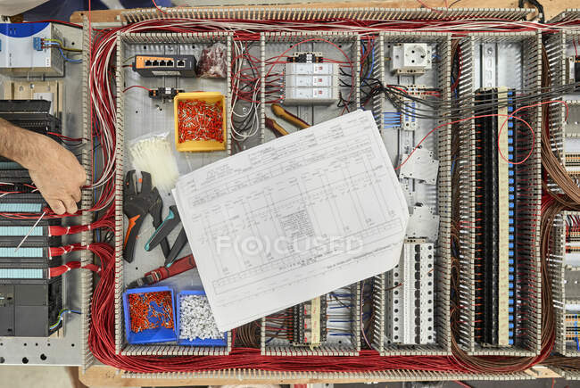 Top view of electrician working on circuitry — Stock Photo