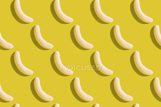 3D illustration of peeled bananas on yellow background — Stock Photo