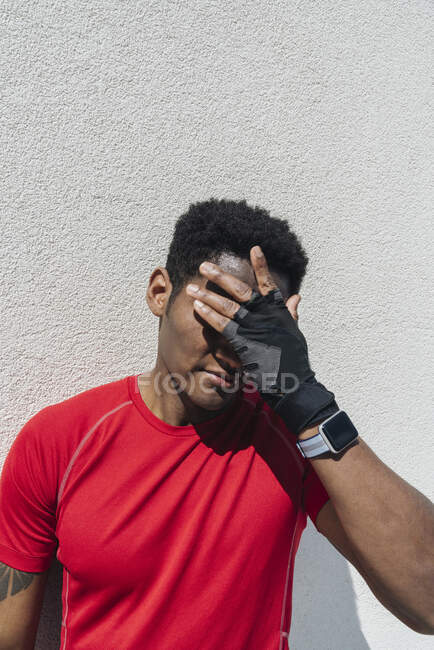Portrait of sportsman wearing smartwatch and gloves — Stock Photo