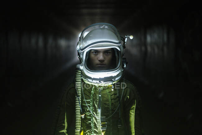 Young spaceman lost in the dark — Stock Photo