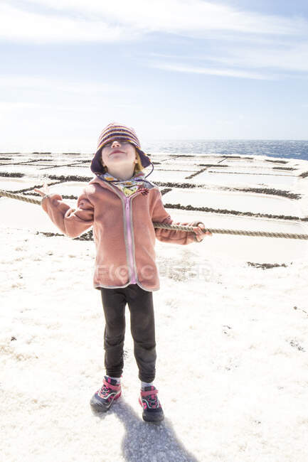 Little girl standing in front of salt pans, Fuencaliente, La Palma, Spain — Stock Photo