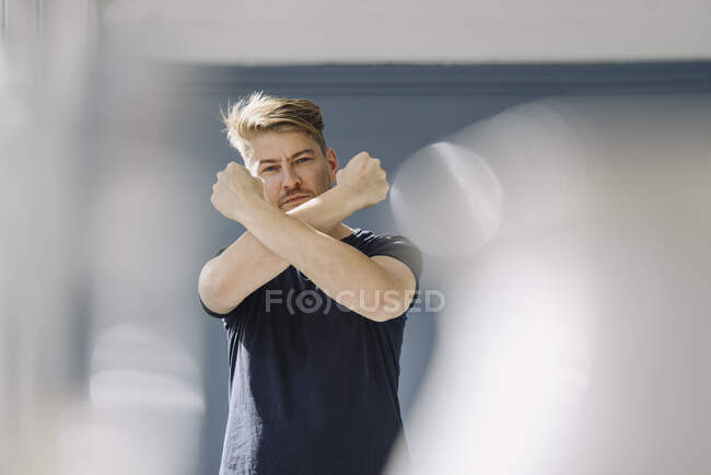 Portrait of a bearded man crossing his arms — Stock Photo