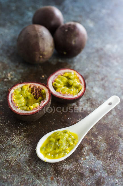 Passion fruit on spoon — Stock Photo