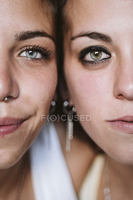 Close-up of lesbian young couple faces — Stock Photo