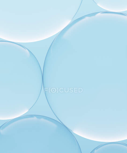 Renderizado tridimensional de esferas de vidrio transparente sobre fondo azul - foto de stock