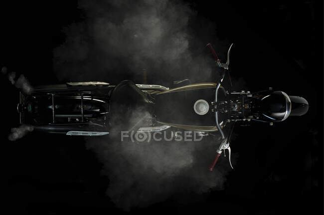 Top view of vintage motorcycle with smoke and black background (Ardie RZ 200 Peter) — Stock Photo