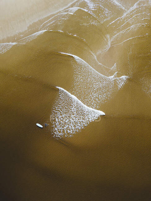 Aerial view of female surfer on sandy coastal beach of  Barents Sea — Stock Photo