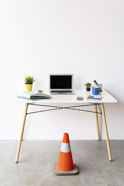 Office desk and cone — Stock Photo