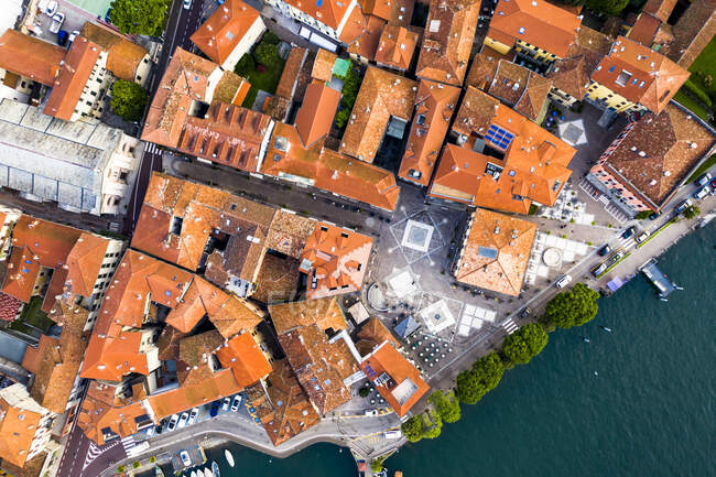 Italy, Province of Como, Menaggio, Helicopter view of house of lakeshore town — стокове фото