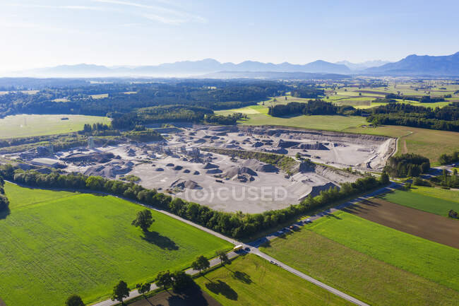 Germany, Bavaria, Huglfing, Drone view of gravel quarry in Alpine foothills during spring — Stock Photo