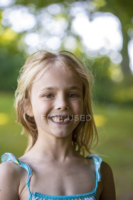 Cute girl with gap toothed standing outdoors — happy, childhood - Stock ...