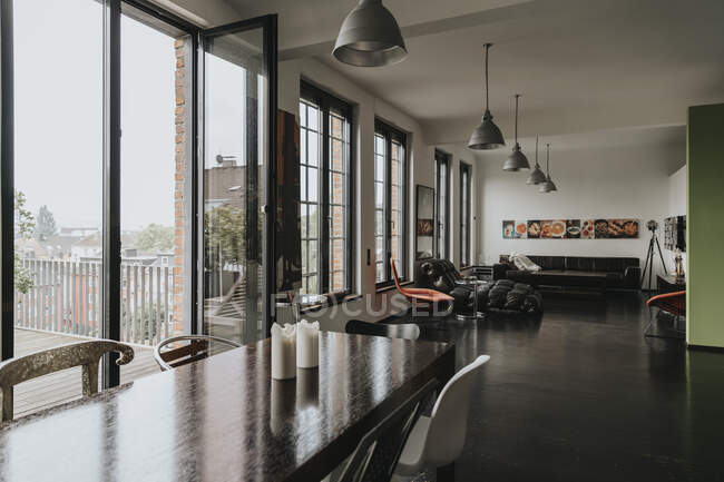 View from dining area to living area in a designer loft — Stock Photo