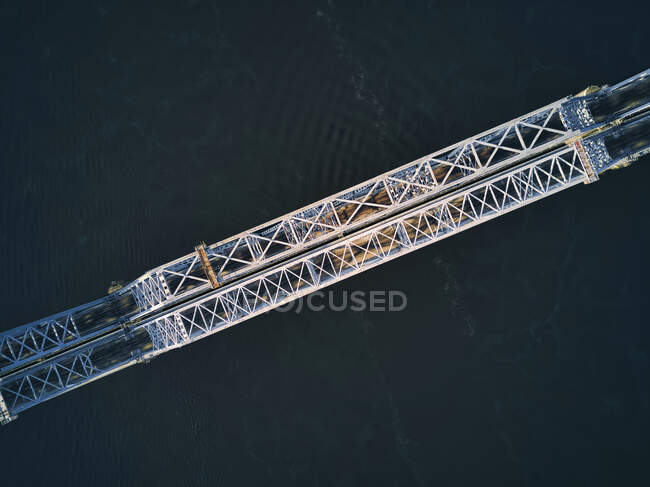 Directly above of metallic railway bridge over Volga River — Stock Photo