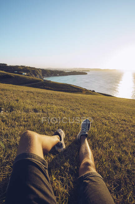 Man relaxing on hill against sky at Mirador de La Providencia, Gijon, Spain — Stock Photo