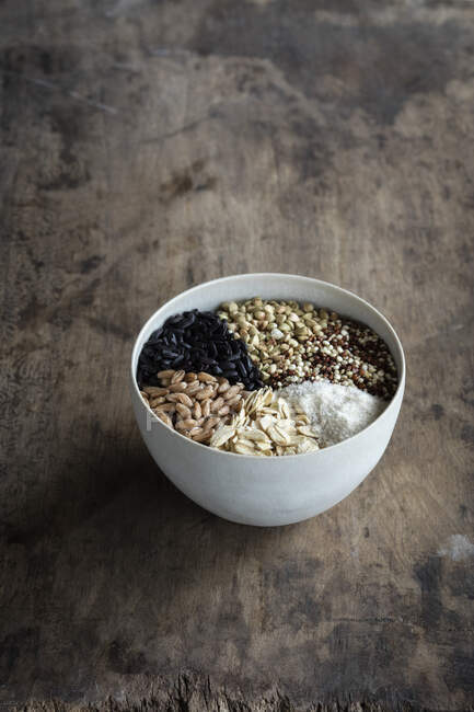 Bowl with different types of grains — Stock Photo