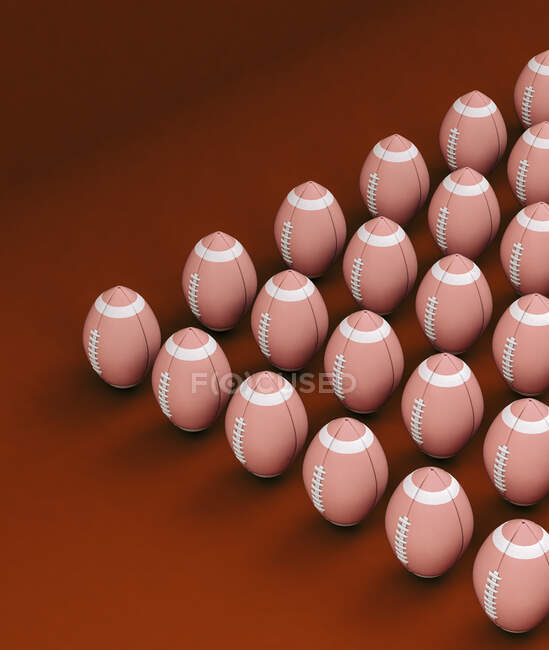 Boules de rugby debout sur fond rouge — Photo de stock