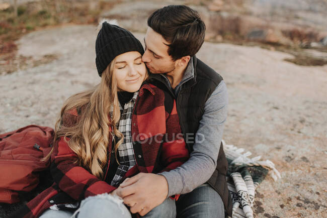 Young couple sitting together during autumn hike — Stock Photo