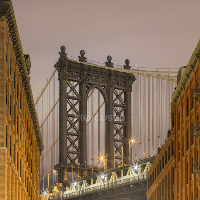 USA, New York, New York City, Manhattan Bridge illuminated at dusk — Stock Photo
