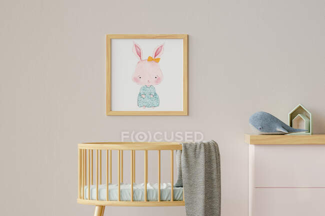 Three dimensional render of picture hanging on wall over empty crib — Stock Photo