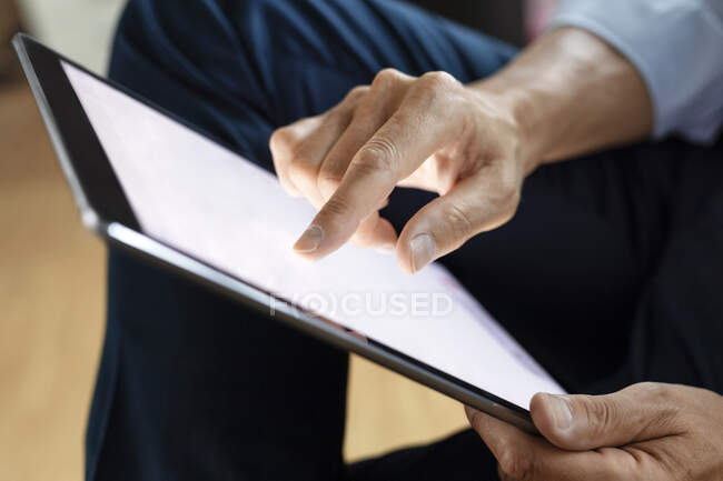 Close-up of businessman using digital tablet — Stock Photo