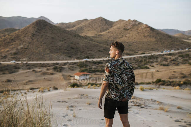 Young man standing in desert at Almeria, Tabernas, Spain — Stock Photo
