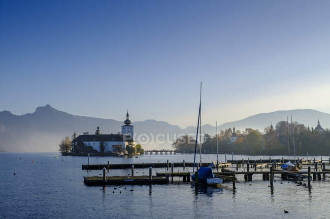 Austria, Upper Austria, Gmunden, Ort castle on Traunsee lake in autumn fog — Stock Photo