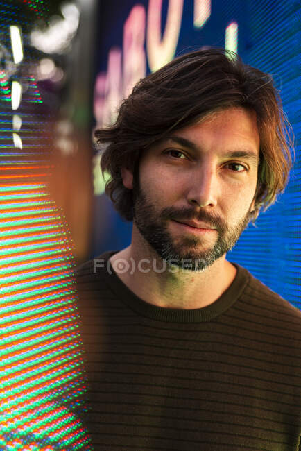 Portrait of man surrounded with digital data — Stock Photo