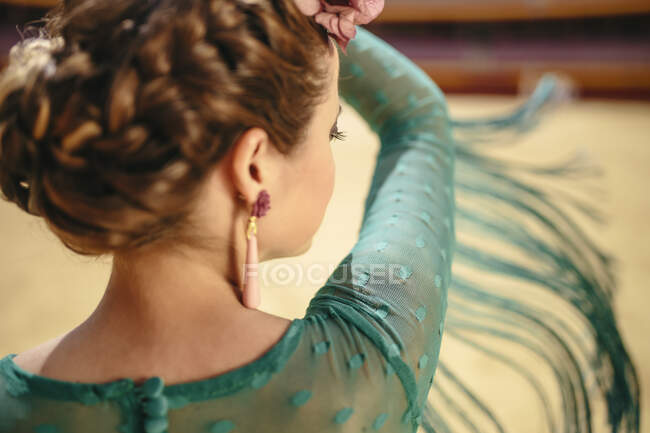 Close-up of flamenco dancer moving fringes while dancing in bullring — Stock Photo