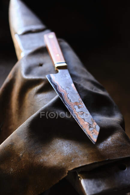 Knife on apron at workshop — Stock Photo